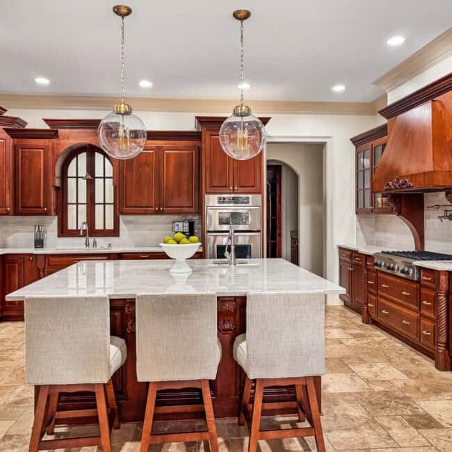 Bright kitchen with classic wooden cabinetry and a central island.