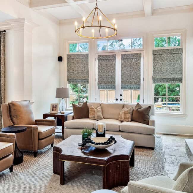 Bright living room with comfortable seating, natural light, and stylish interior design elements.