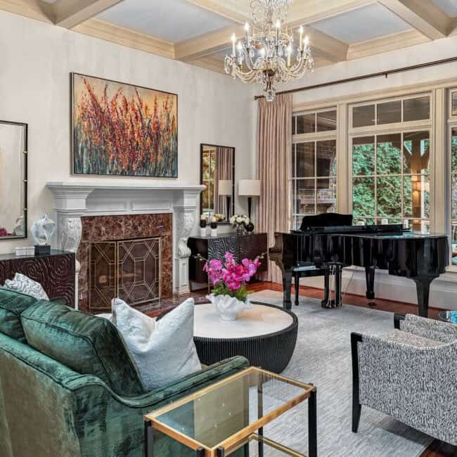 Bright living room featuring a grand piano and fireplace.