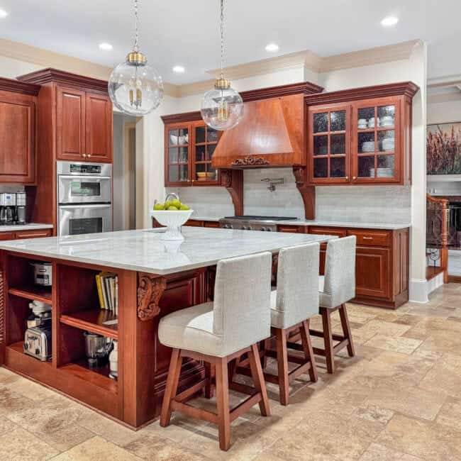 Bright and spacious kitchen with cherry wood cabinetry and modern appliances.