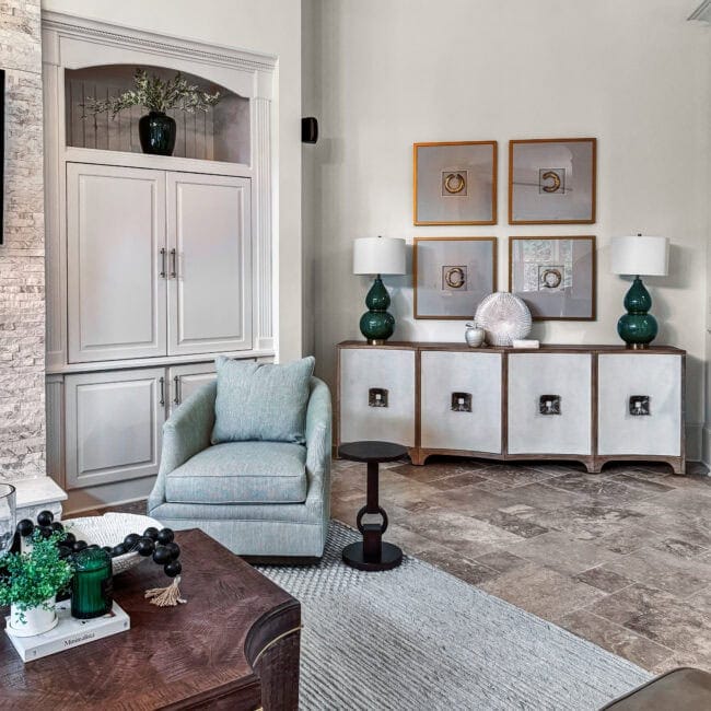 Elegant living room with modern furniture, artwork, and decorative accents.