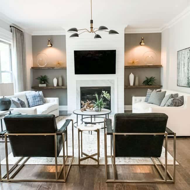 Spacious living room with fireplace, wall art, and stylish seating for family gatherings.