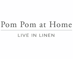 Soft pom pom decorations for home interior styling, adding texture and charm.
