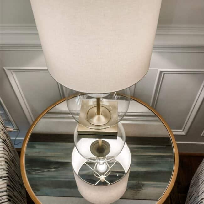 Versatile home decor featuring a modern glass-based table lamp perfect for living rooms or bedrooms.