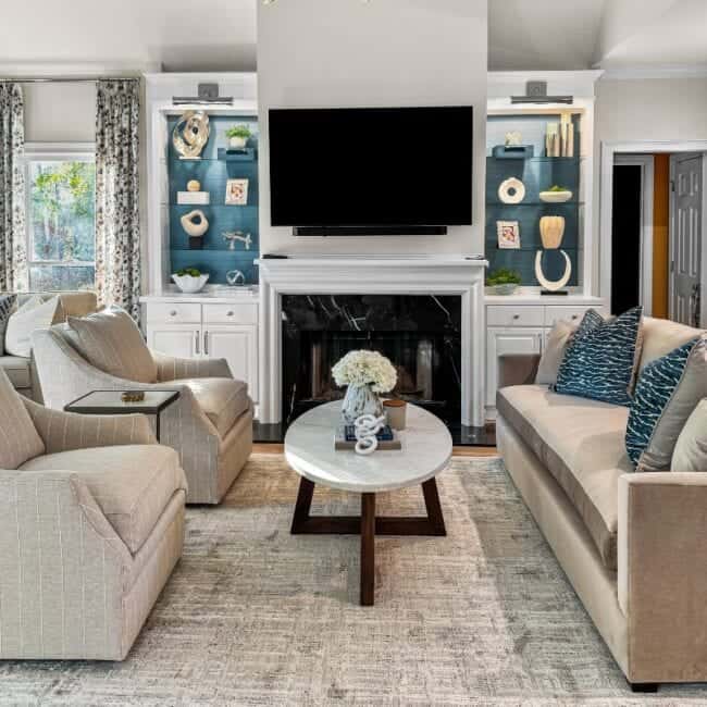 Modern living room with cozy seating and stylish decor.