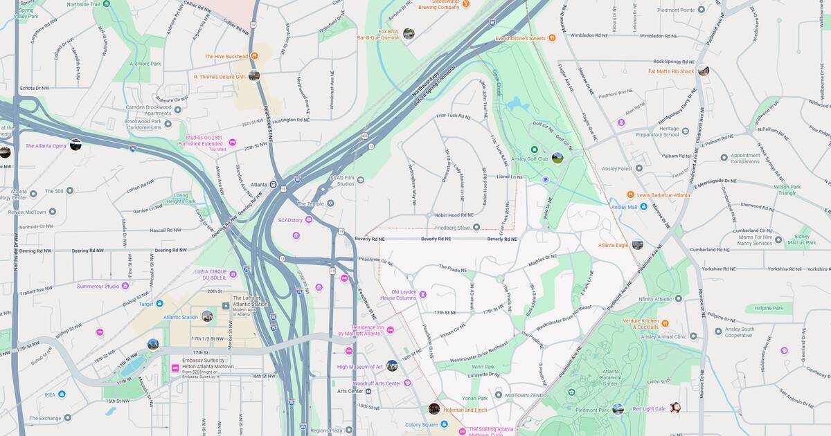 Map of a city showing highways, streets, and green areas.