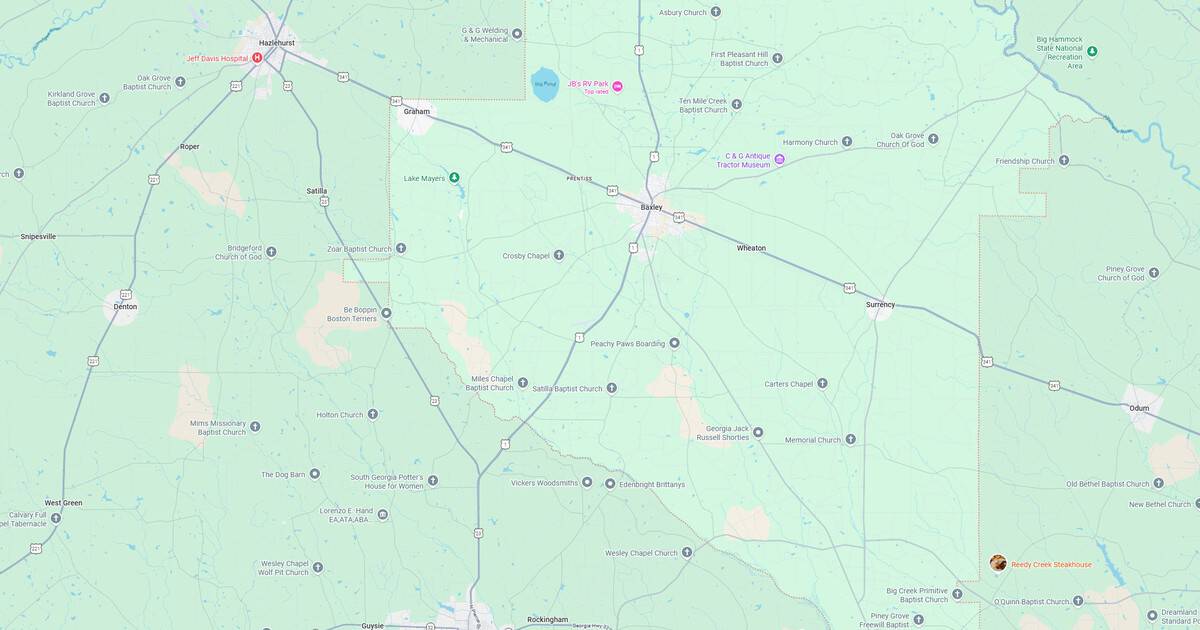 Sunset over a city map highlighting roads and landmarks.