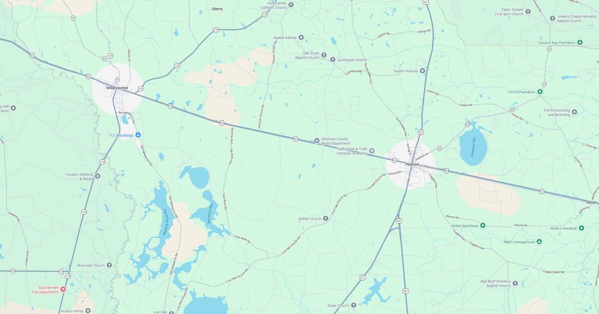 Map of a city with roads, lakes, and surrounding areas, showing detailed geographic features.