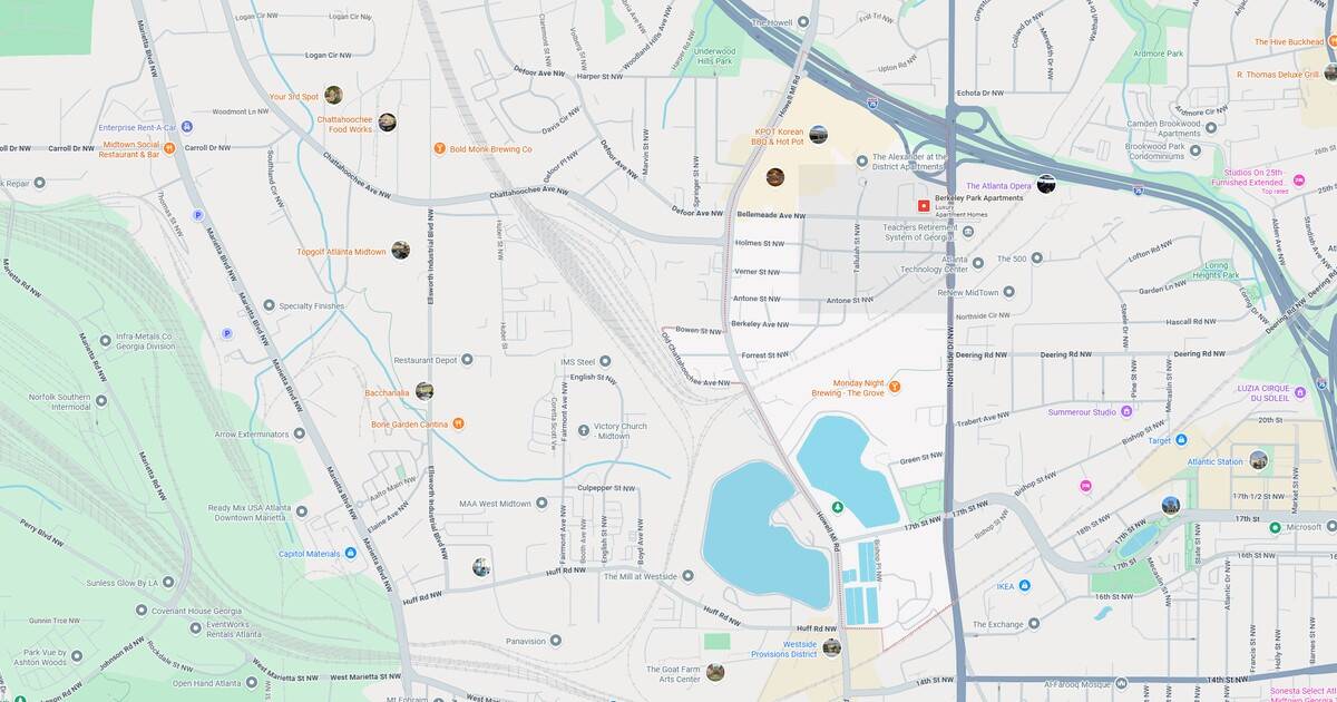City map with roads, parks, and a lake in a suburban neighborhood.