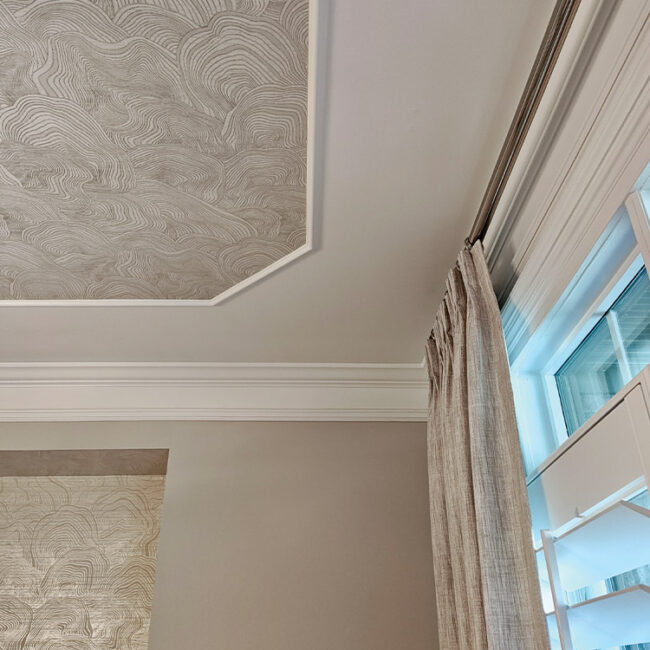 Decorative ceiling with textured pattern and modern decor.
